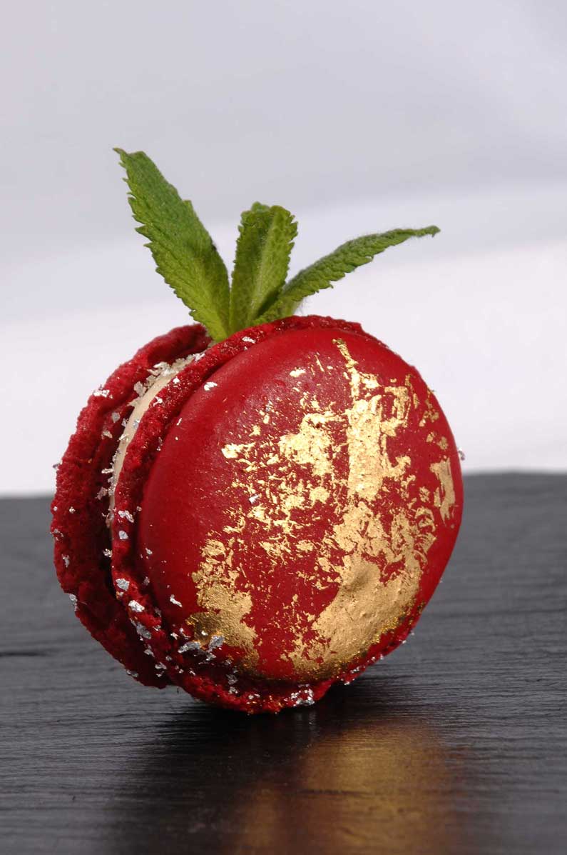 Berry Macaron with edible silver flakes and gold leaf