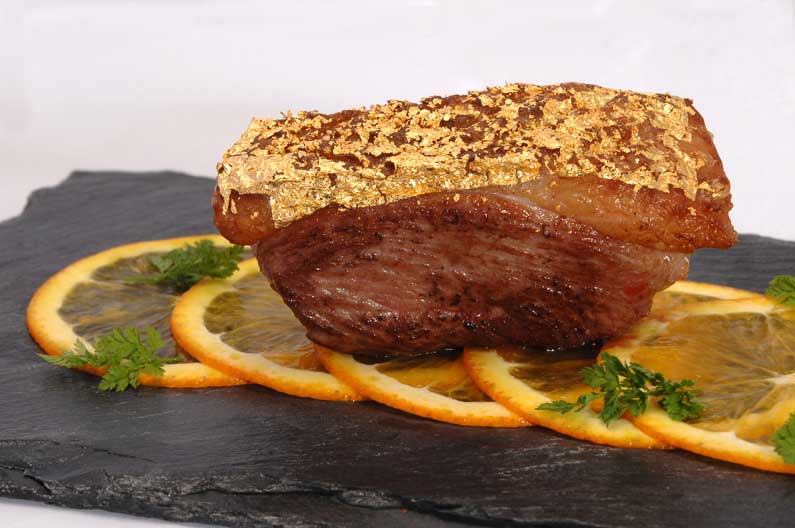 Duck “à l’Orange” with edible gold crust