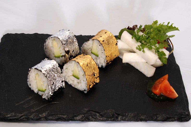 sushi decorated with edible gold and silver